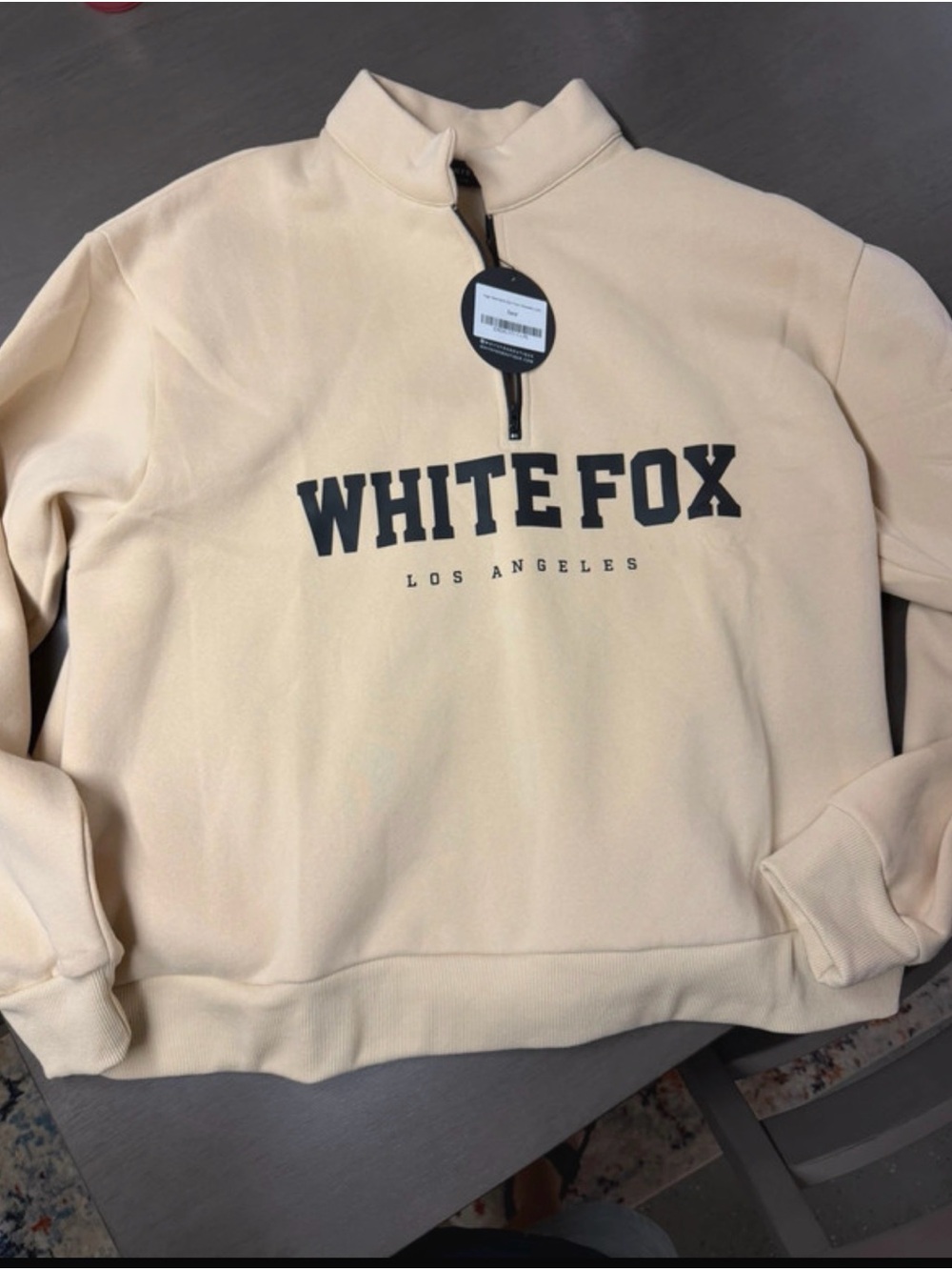 White Fox Boutique Cream Half-Zip Sweatshirt with Black Logo